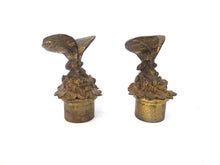 Antique brass candle snuffer with butterfly.