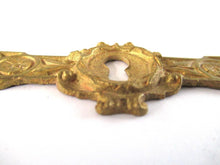 UpperDutch:Keyhole cover,Antique ornate brass keyhole cover, plate. Ornamental escutcheon, cabinet hardware, furniture applique, ormolu.