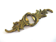UpperDutch:Keyhole cover,Antique ornate brass keyhole cover. Ornamental escutcheon, cabinet hardware, furniture applique.