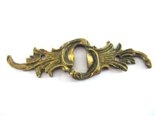 UpperDutch:Keyhole cover,Antique ornate brass keyhole cover. Ornamental escutcheon, cabinet hardware, furniture applique.