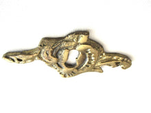 Antique brass keyhole cover. Ornamental escutcheon, cabinet hardware, furniture applique.