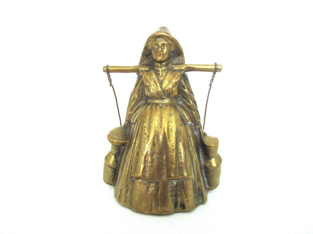 Vintage brass table bell, woman with milk jugs.