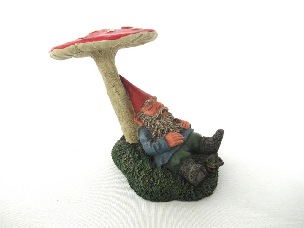 Gnome sleeping under a mushroom. 'Slumber Chief' a design by Rien Poortvliet.