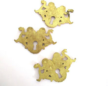 1 (ONE) Antique Brass Cherub Escutcheon, keyhole cover, frame, Furniture Applique.