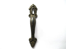 Cabinet Pull including keyhole cover, escutcheon.