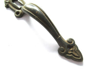 Cabinet Pull including keyhole cover, escutcheon.