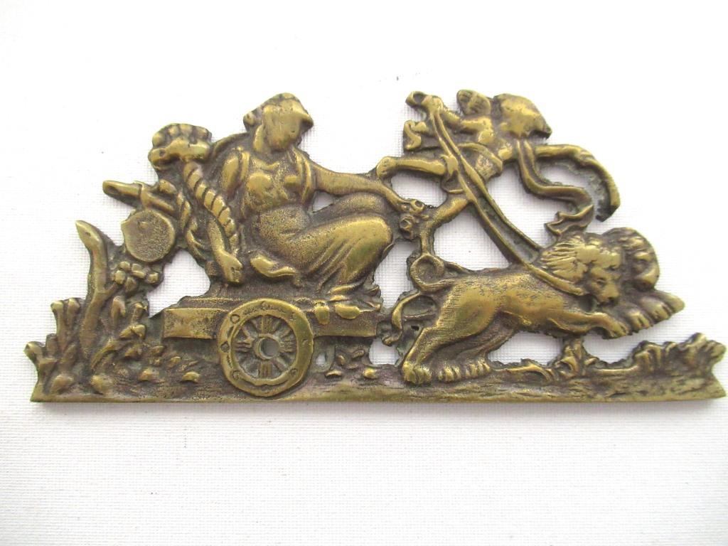 Antique embellishment, ornament, pediment. Empire, lions, chariot.