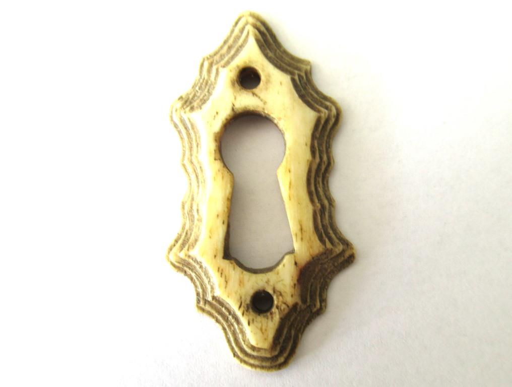 Antique bone escutcheon, keyhole cover.
