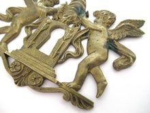 Antique Brass keyhole cover, ornament, embellishment, putti, cherub, angel.