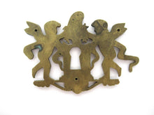 Antique Brass keyhole cover, ornament, embellishment, putti, cherub, angel.