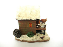 Gnome Villages 'House with Wren' after a design by Rien Poortvliet, feeding bird.