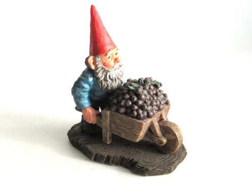 UpperDutch:,Classic Gnomes 'Christian' after a design by Rien Poortvliet. Gnome figurine transporting grapes with a wheelbarrow.