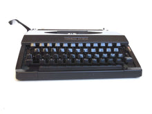 UpperDutch:Typewriter,Working Typewriter 1970's Matte black Torpedo Athena, QWERTY keyboard. Made in the 1970s. Man cave desk accessoire decoration.