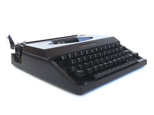 UpperDutch:Typewriter,Working Typewriter 1970's Matte black Torpedo Athena, QWERTY keyboard. Made in the 1970s. Man cave desk accessoire decoration.