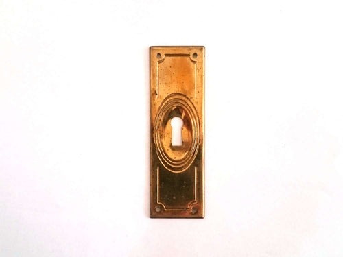 UpperDutch:Hooks and Hardware,Stamped brass keyhole escutcheon, vintage keyhole cover, keyhole plate. Restoration hardware, shabby furniture hardware.