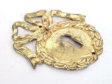 UpperDutch:,1 (ONE) French Keyhole cover, Empire Solid brass large Key Hole Frame. Oval leaf and bow shape. Restoration hardware.