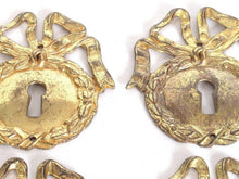 UpperDutch:,1 (ONE) French Keyhole cover, Empire Solid brass large Key Hole Frame. Oval leaf and bow shape. Restoration hardware.