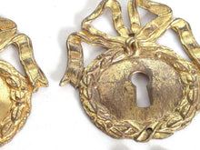 UpperDutch:,1 (ONE) French Keyhole cover, Empire Solid brass large Key Hole Frame. Oval leaf and bow shape. Restoration hardware.