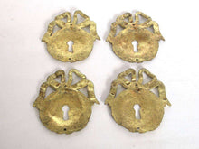 UpperDutch:,1 (ONE) French Keyhole cover, Empire Solid brass large Key Hole Frame. Oval leaf and bow shape. Restoration hardware.