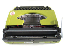 UpperDutch:Typewriter,Brother Deluxe 220 working typewriter. Green metal body, two tone ink ribbon. Portable writing machine.Office decor QWERTY layout