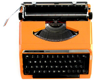 UpperDutch:Typewriter,Silver-Reed 100 working typewriter made in 1976. 1970's Orange typewriter, Silver Seiko Co Japanese QWERTY writing machine