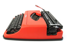 UpperDutch:Typewriter,Underwood 35 working typewriter. 1970's Orange typewriter, QWERTY keyboard layout, two tone ink ribbon. Plastic writing machine