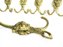Vintage brass lion head wall hook, coat hook.