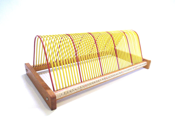 Vinyl record storage rack, retro vinyl record holder. Music storage, singles rack.