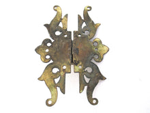 Authentic antique brass hinges.