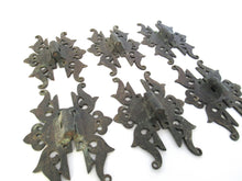 Authentic antique brass hinges.