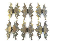 Authentic antique brass hinges.