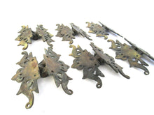 Authentic antique brass hinges.