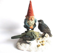Gnome statue 'Thomas & Birds'. David the gnome feeding birds in the snow. Designed by Rien Poortvliet.