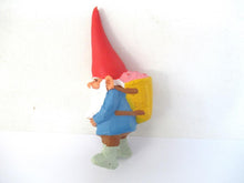 David the gnome with a basket full of strawberries on his back, after a design by Rien Poortvliet, David the Gnome. BRB