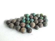 UpperDutch:Marbles,Green Antique marbles, Set of 30 antique clay marbles.