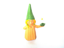 Brb Gnome holding candle after a design by Rien Poortvliet, Lisa the Gnome. Orange Pajamas
