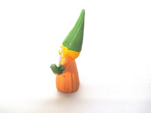 Brb Gnome holding candle after a design by Rien Poortvliet, Lisa the Gnome. Orange Pajamas
