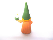 Brb Gnome holding candle after a design by Rien Poortvliet, Lisa the Gnome. Orange Pajamas