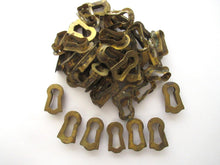 1 (ONE) Tiny antique brass keyhole insert, key hole cover. Furniture decoration. Distressed hardware. Restoration supply for chest / box.