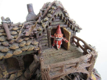 UpperDutch:Gnomes,Gnome figurine after a design by Rien Poortvliet Classic Gnomes Villages 'Gnome-house and mouse'.