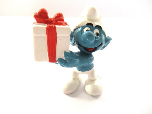 Smurf with present / gift, Jokey, Schleich, Peyo, Pvc figurine.