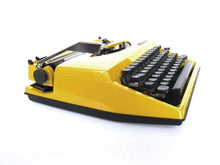 UpperDutch:Typewriter,Mustard Yellow Triumph Tippa made in 1977, QWERTY layout. Fully functional typewriter, vintage. Mustard yellow retro office decor.