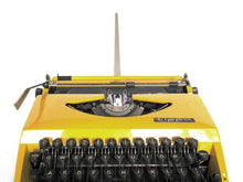 UpperDutch:Typewriter,Mustard Yellow Triumph Tippa made in 1977, QWERTY layout. Fully functional typewriter, vintage. Mustard yellow retro office decor.