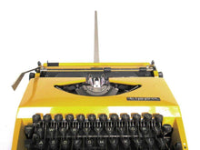 UpperDutch:Typewriter,Mustard Yellow Triumph Tippa made in 1977, QWERTY layout. Fully functional typewriter, vintage. Mustard yellow retro office decor.