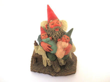 Gnome figurine with grandchildren sitting in a chair. 'Grandfather with Children' Classic Gnomes designed by Rien Poortvliet