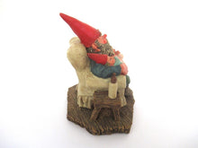Gnome figurine with grandchildren sitting in a chair. 'Grandfather with Children' Classic Gnomes designed by Rien Poortvliet