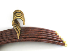 Set of 6 Vintage clothes hangers.
