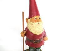 Gnome statue with broom after a design by Rien Poortvliet, David the Gnome.