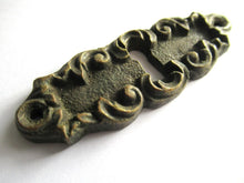 Vintage brass escutcheon, keyhole cover, Victorian style.