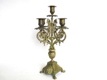 UpperDutch:Candelabras,Antique 5-arm candle holder. Antique Solid Brass 5 arm Candelabra with Griffins / Dragons.